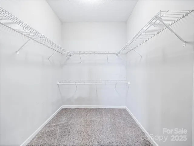 a view of entryway and kitchen