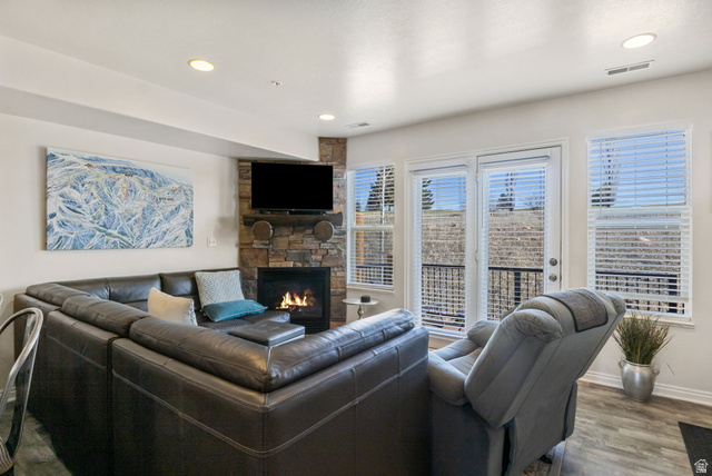 3598 North Huntsman Path, Unit 502 Eden, UT 84310 - Photo 5 of 43 Living room with wood finished floors, a fireplace, and recessed lighting