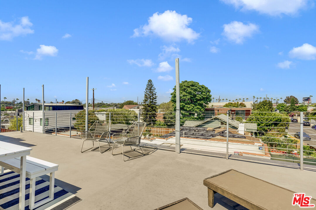809 Brooks Avenue Venice, CA 90291 - Photo 30 of 32 a view of a terrace with wooden floor and outdoor seating