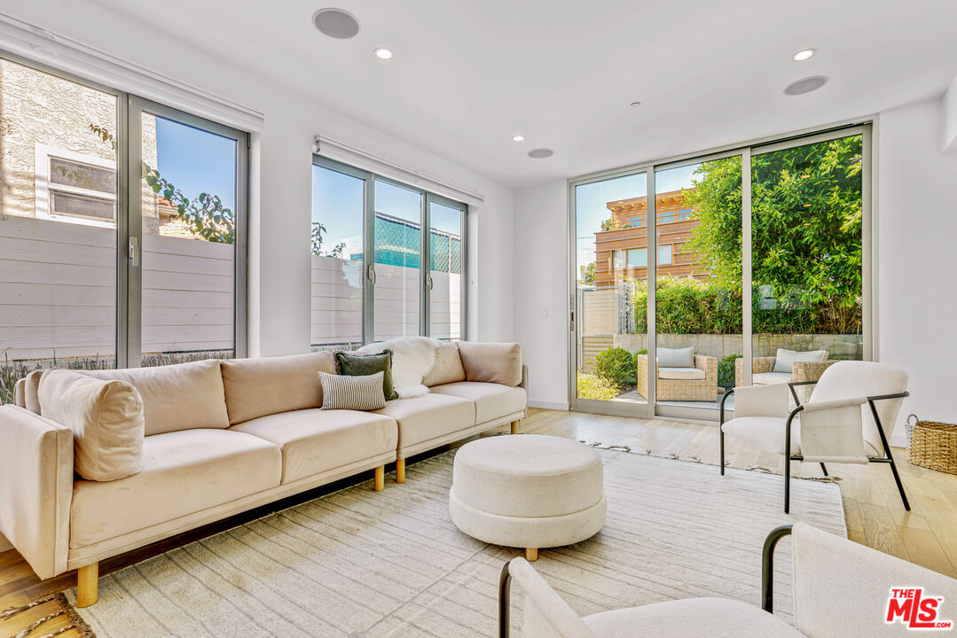 809 Brooks Avenue Venice, CA 90291 - Photo 4 of 32 a living room with furniture and a large window