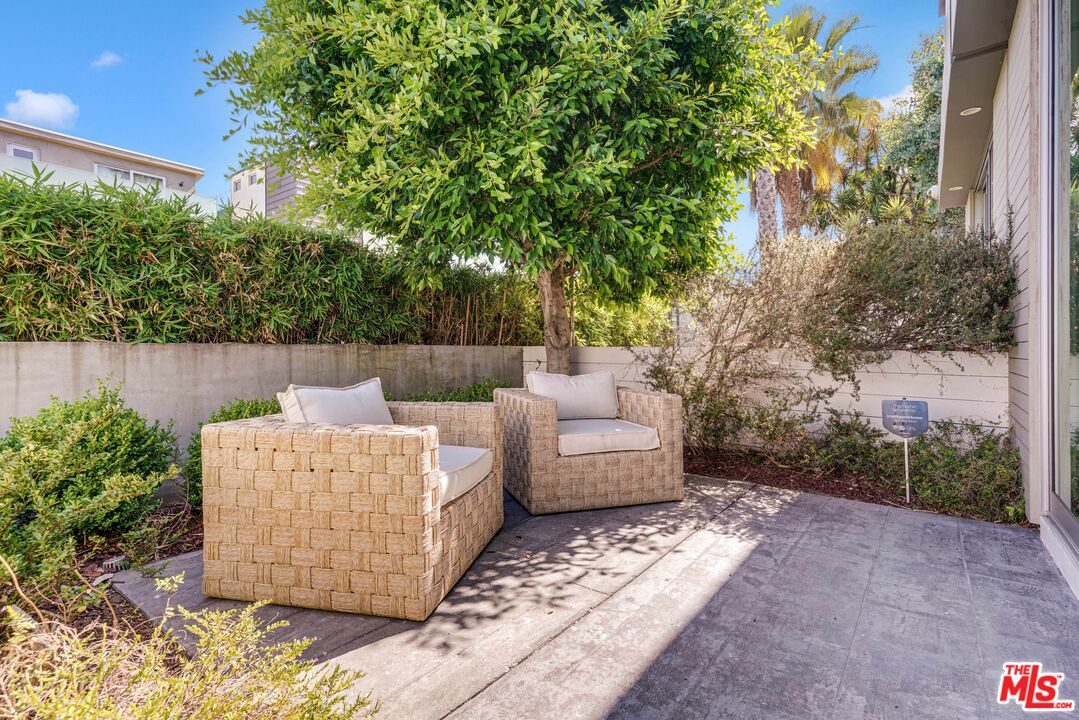 809 Brooks Avenue Venice, CA 90291 - Photo 6 of 32 a view of backyard with furniture and trees