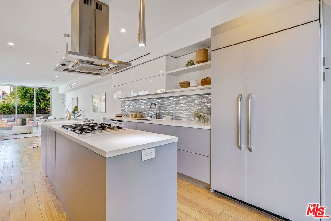 809 Brooks Avenue Venice, CA 90291 - Photo 7 of 32 a kitchen with stainless steel appliances granite countertop a sink and a refrigerator