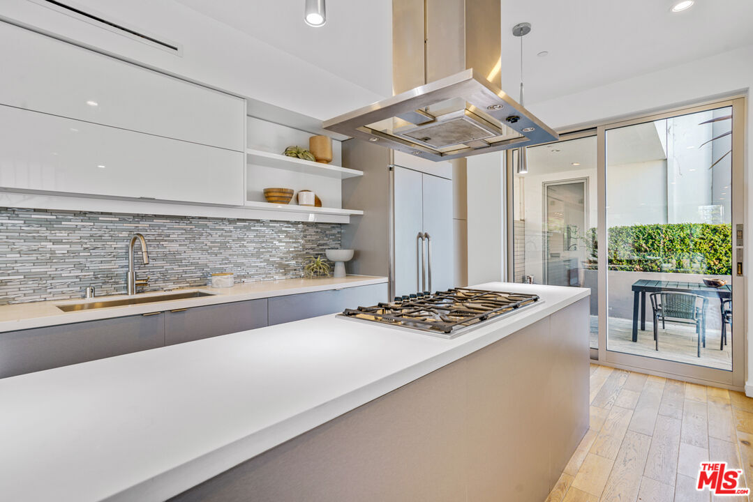 809 Brooks Avenue Venice, CA 90291 - Photo 8 of 32 a kitchen with stainless steel appliances granite countertop a sink stove and refrigerator
