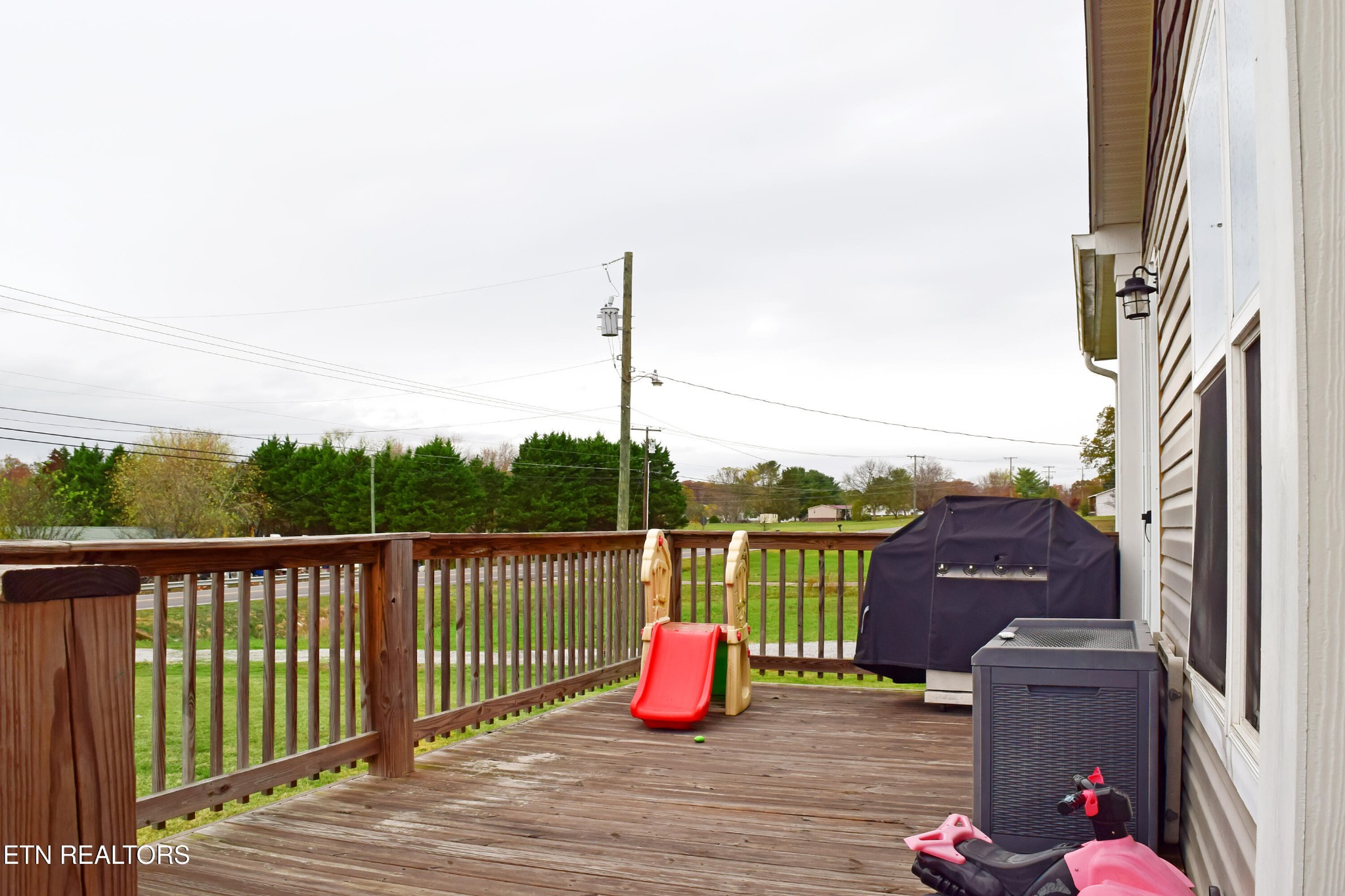 121 Watkins Road East Loudon, TN 37774 - Photo 4 of 26 a view of roof deck with chair and wooden floor