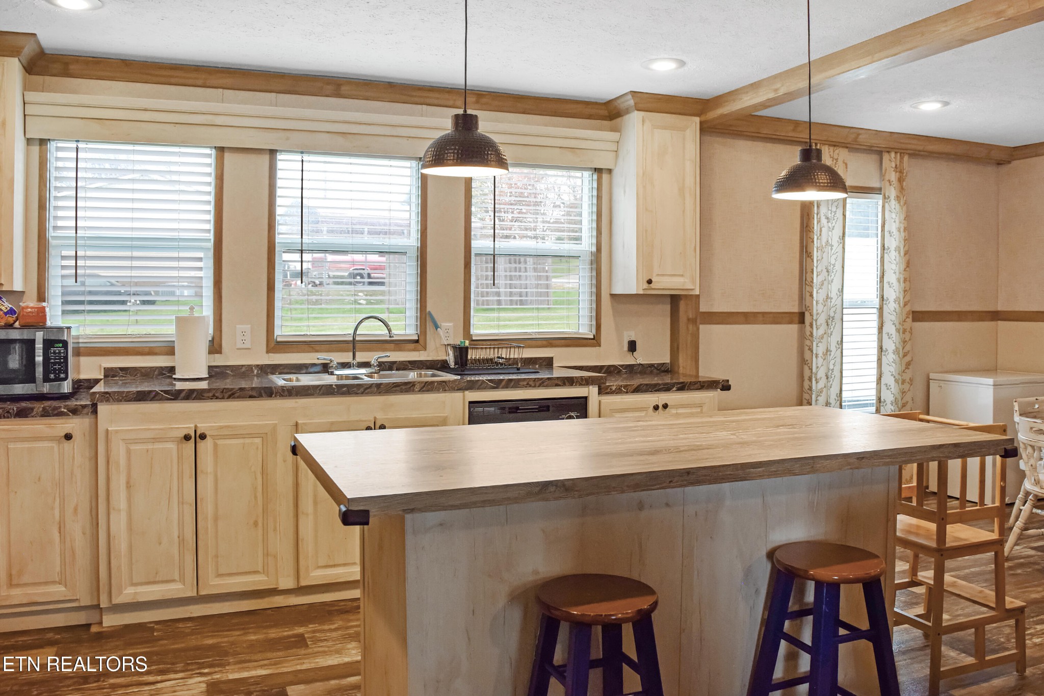 121 Watkins Road East Loudon, TN 37774 - Photo 8 of 26 a kitchen with stainless steel appliances a sink and a large window