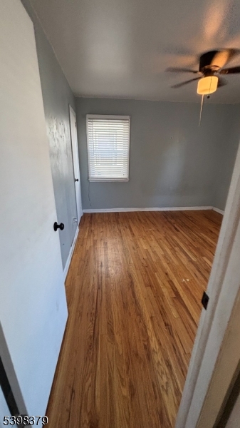 1315 Biscayne Boulevard Union, NJ 07083 - Photo 2 of 7 a view of an empty room with wooden floor and a window