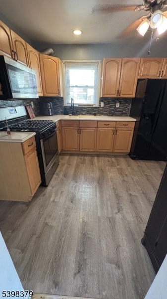 1315 Biscayne Boulevard Union, NJ 07083 - Photo 5 of 7 a kitchen with granite countertop a sink cabinets and stainless steel appliances