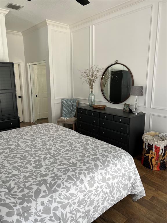 7352 Southeast Seagate Lane Stuart, FL 34997 - Photo 13 of 19 a bedroom with a bed and a dresser