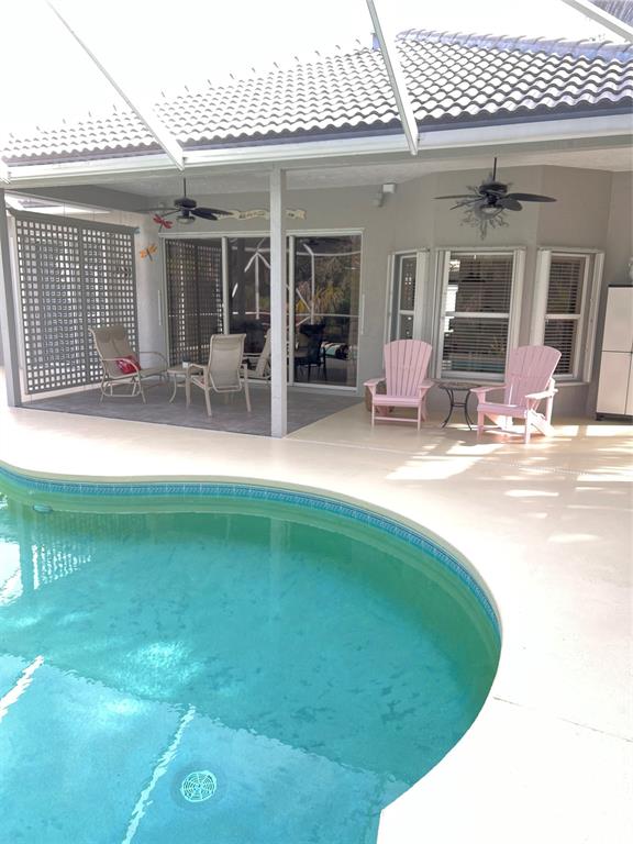 7352 Southeast Seagate Lane Stuart, FL 34997 - Photo 19 of 19 a swimming pool with outdoor seating yard and barbeque oven