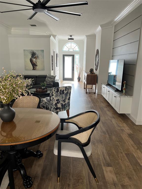7352 Southeast Seagate Lane Stuart, FL 34997 - Photo 5 of 19 a dining room with furniture and wooden floor
