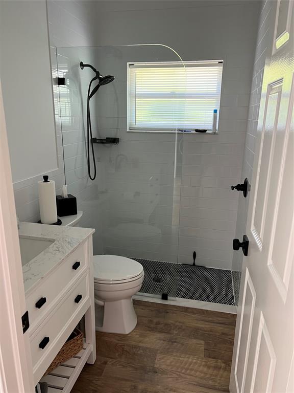 7352 Southeast Seagate Lane Stuart, FL 34997 - Photo 9 of 19 a bathroom with a sink a toilet and shower