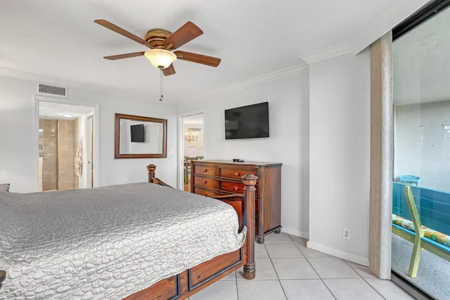 a view of walk in closet with clothes