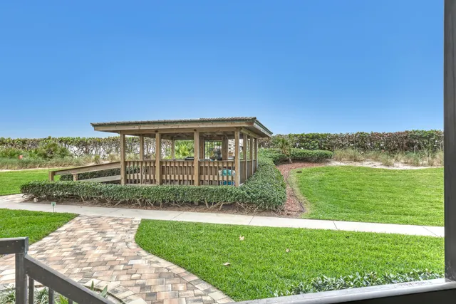a view of swimming pool with outdoor seating