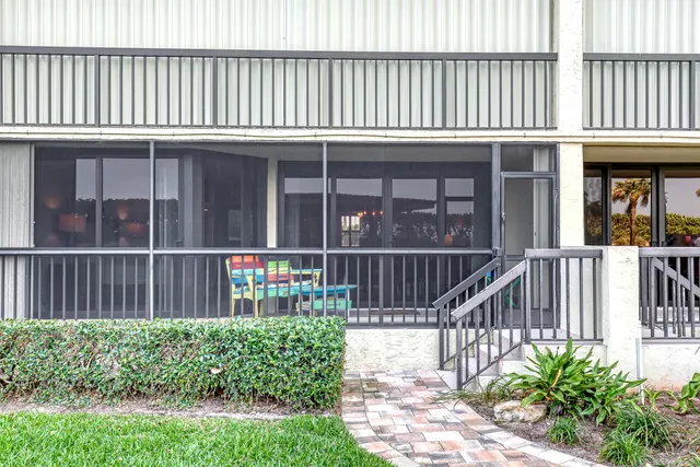 a view of swimming pool with outdoor seating and city view