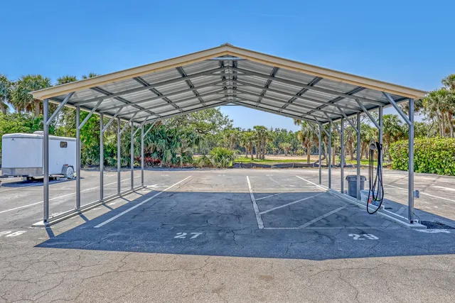 a view of a refrigerator in kitchen and living room