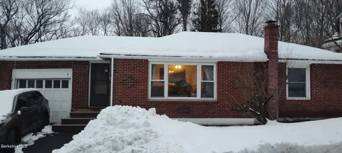 a front view of a house with garage