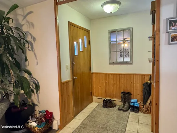 a room with furniture and a potted plant