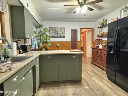 a bedroom with two beds and a dresser