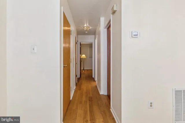 a view of a bathroom from a hallway