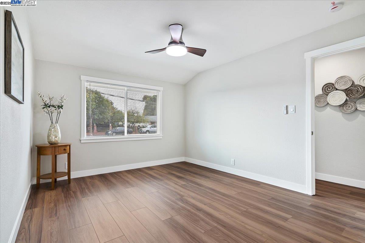 1154 Tilson Drive Concord, CA 94520 - Photo 15 of 25 a view of an empty room with wooden floor and a window