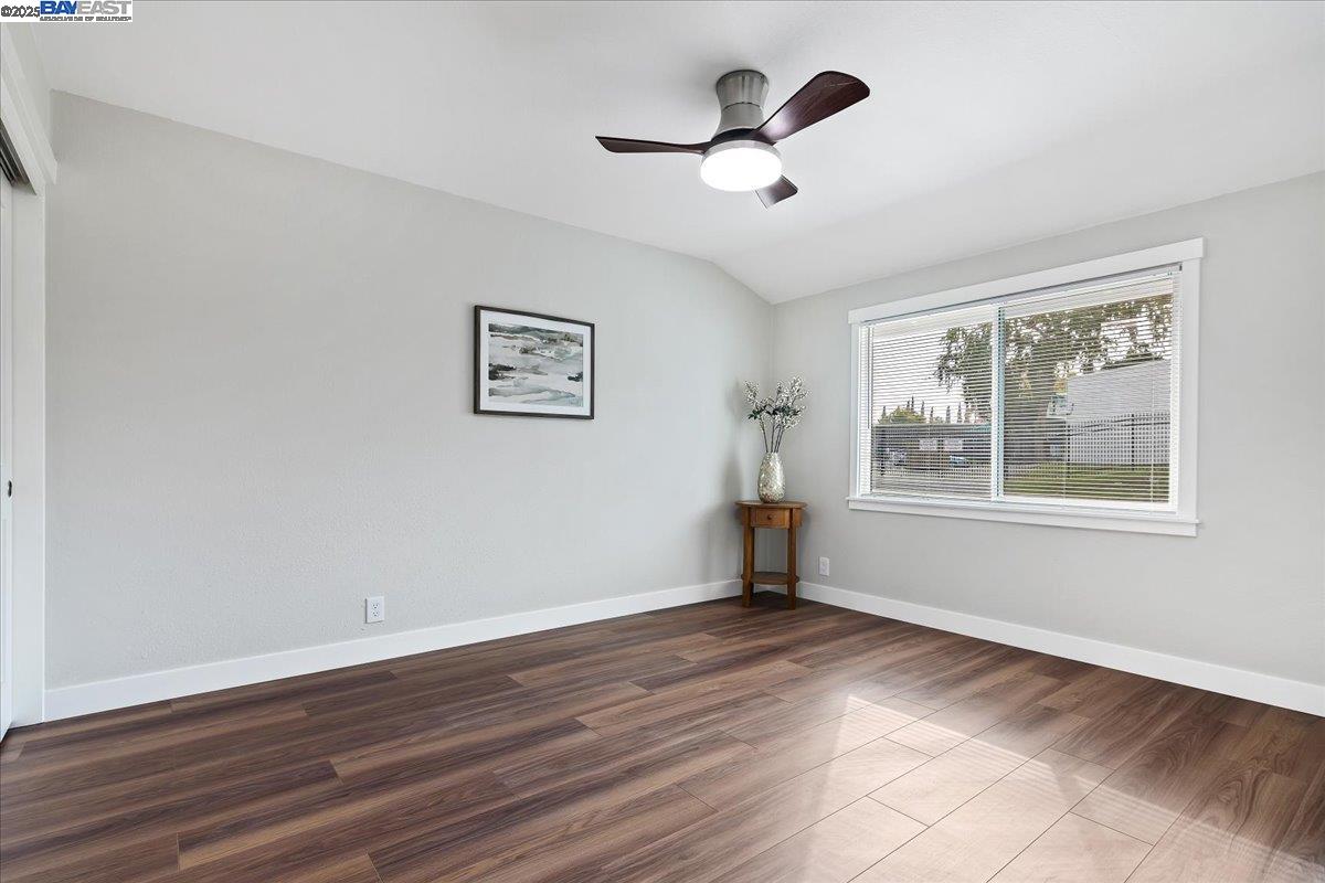 1154 Tilson Drive Concord, CA 94520 - Photo 16 of 25 a view of a big room with wooden floor and windows