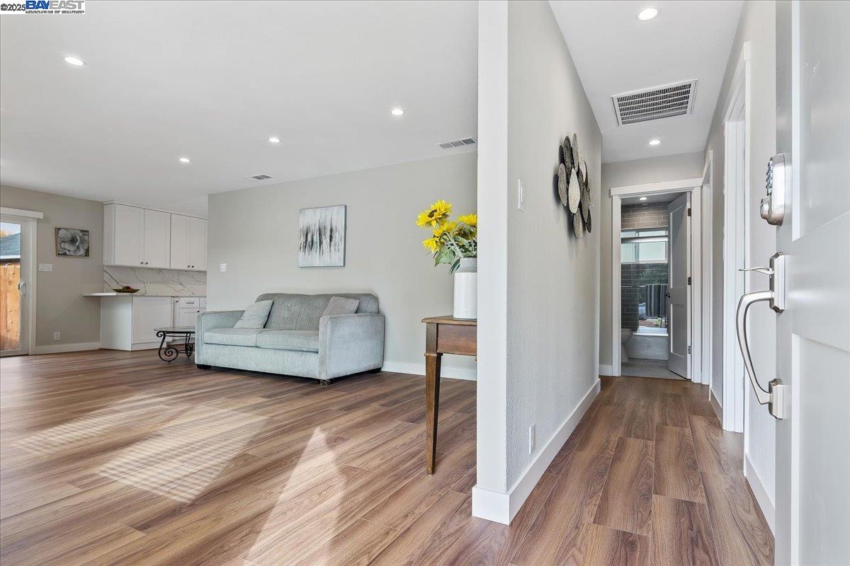 1154 Tilson Drive Concord, CA 94520 - Photo 4 of 25 a living room with furniture and a wooden floor