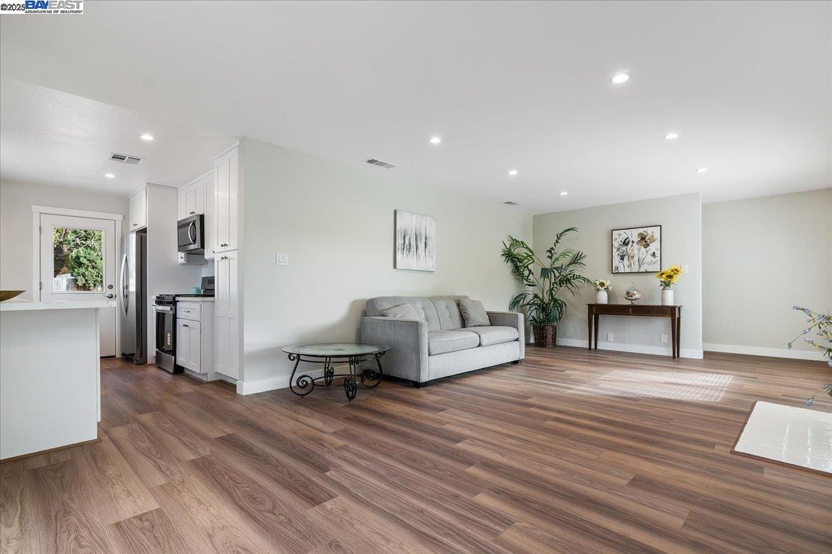 1154 Tilson Drive Concord, CA 94520 - Photo 7 of 25 a living room with furniture and a wooden floor