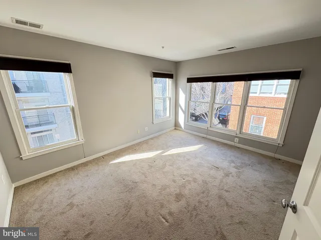 an empty room with windows