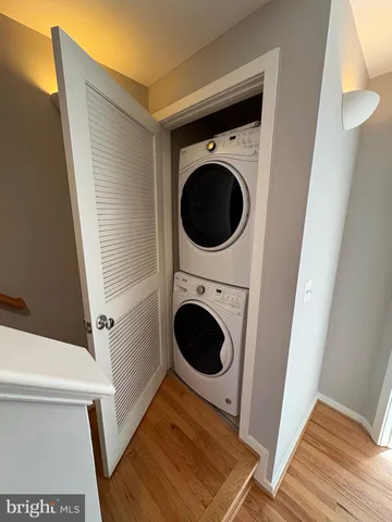 a view of a hallway with washer and dryer