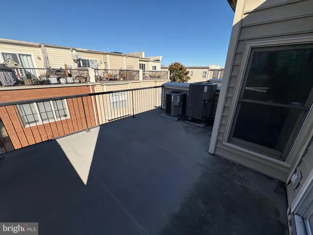 a view of balcony with furniture
