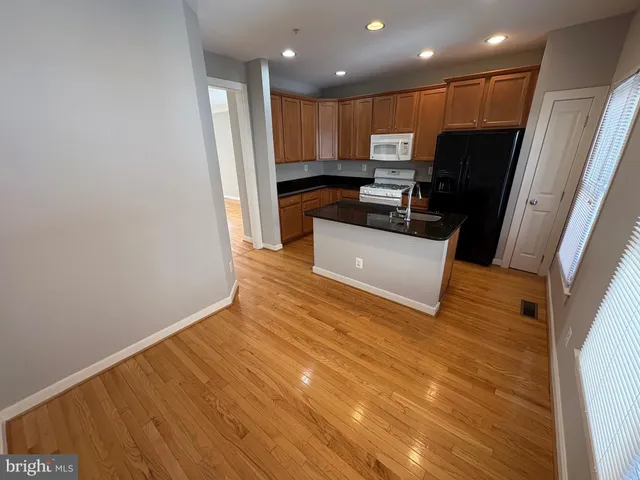 a view of kitchen with wooden floor