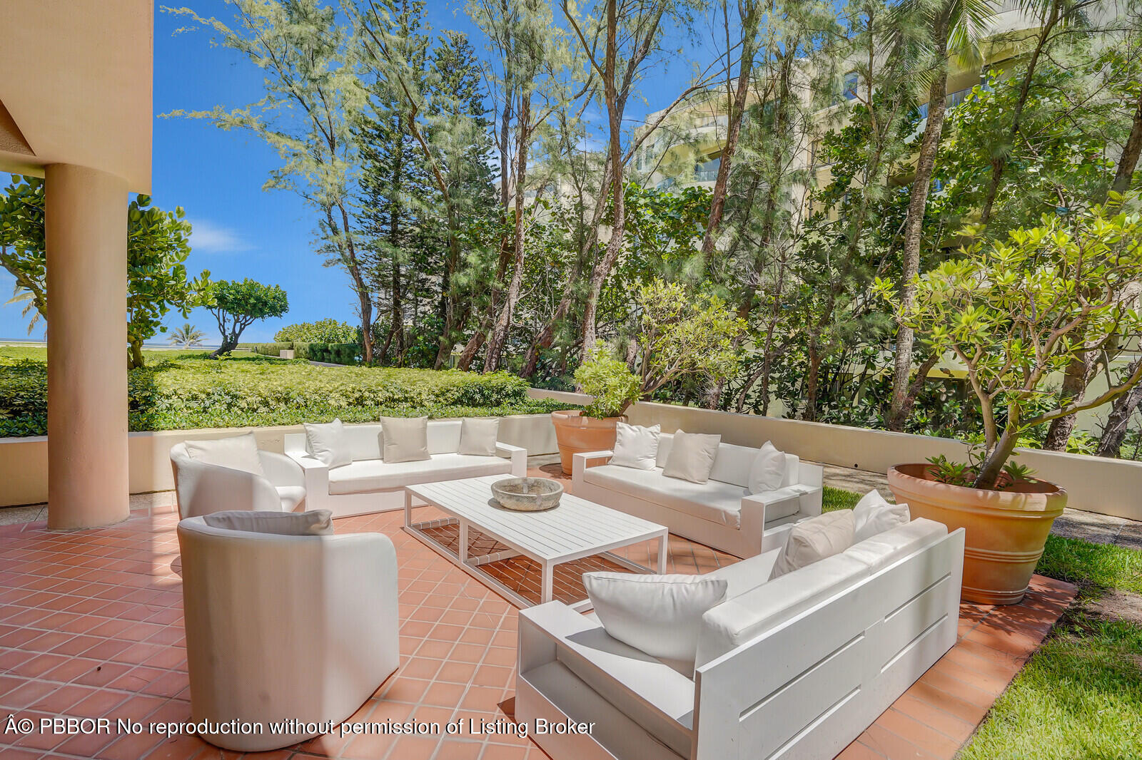 2 North Breakers Row, Unit ST2 Palm Beach, FL 33480 - Photo 28 of 30 a view of a chairs and table in the backyard