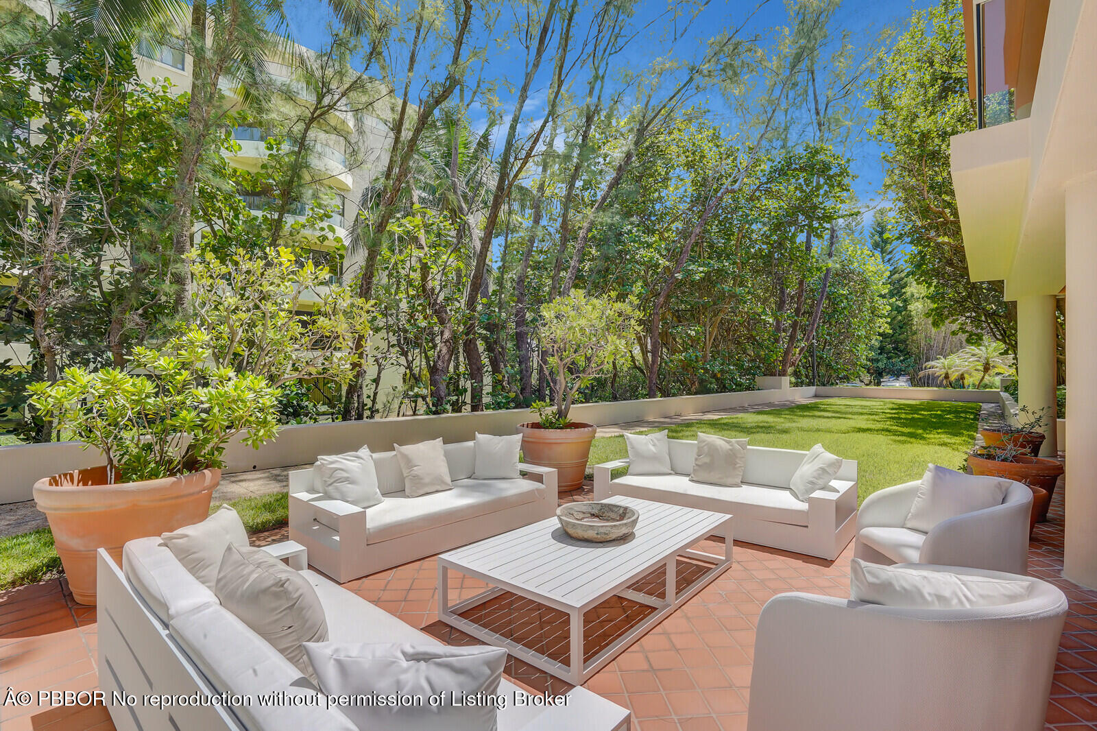 2 North Breakers Row, Unit ST2 Palm Beach, FL 33480 - Photo 29 of 30 a view of a patio with couches table and chairs and potted plants