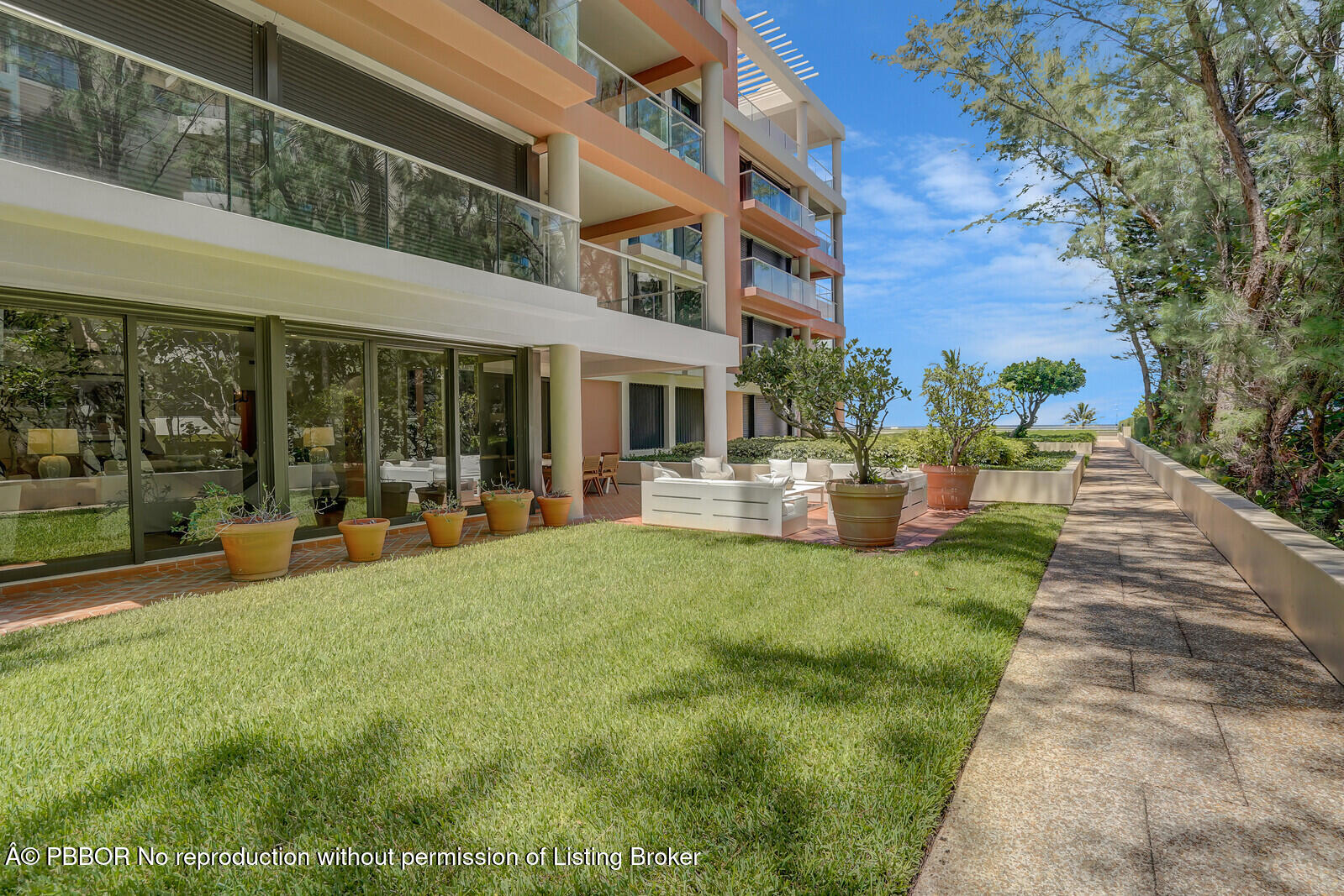 2 North Breakers Row, Unit ST2 Palm Beach, FL 33480 - Photo 30 of 30 a view of a building with a garden and sitting area