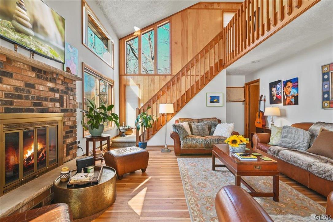 176 Stafford Drive Bushkill, PA 18324 - Photo 16 of 50 a living room with furniture and a fireplace
