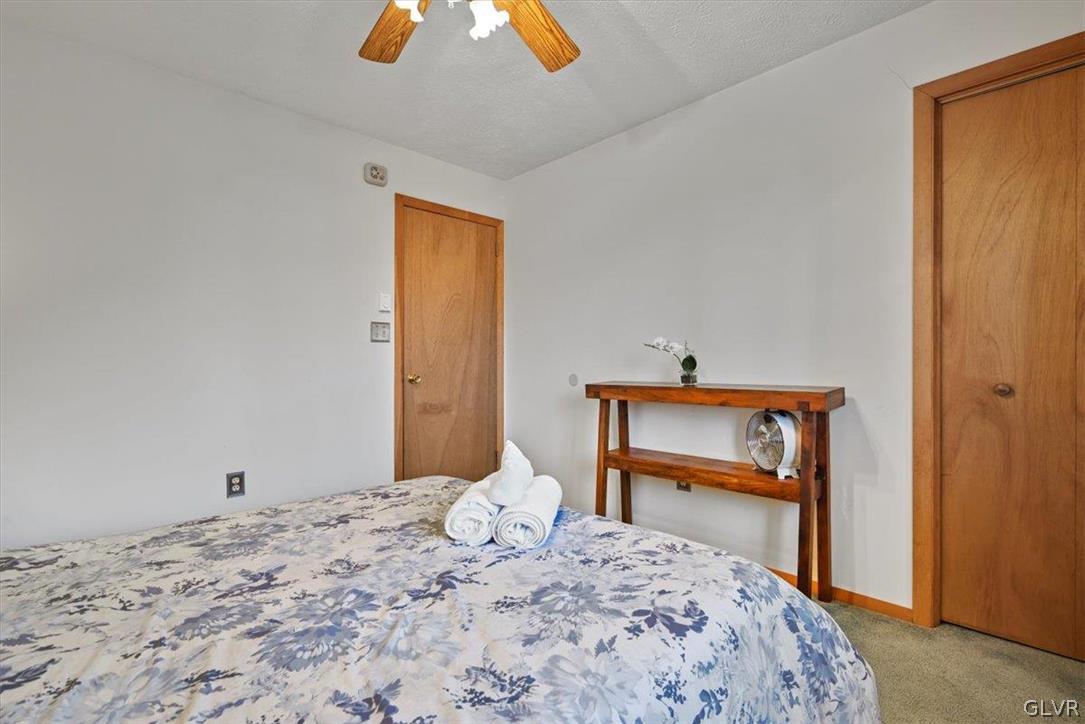 176 Stafford Drive Bushkill, PA 18324 - Photo 37 of 50 a bedroom with a bed and a dresser