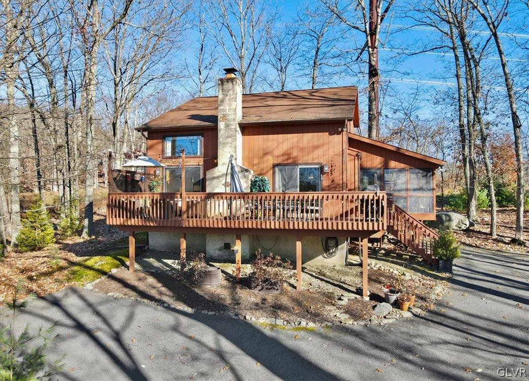 176 Stafford Drive Bushkill, PA 18324 - Photo 5 of 50 a view of a house with a roof deck