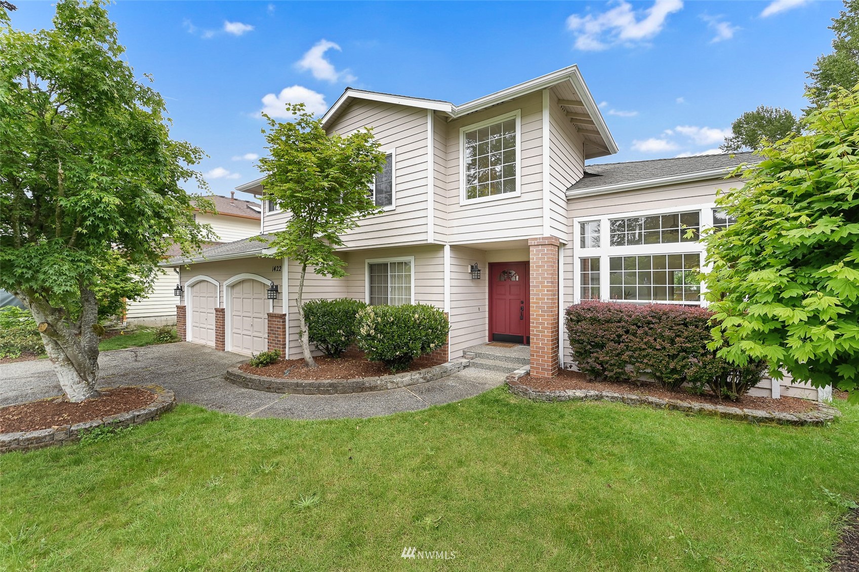 1422 243rd Place Southwest Bothell, WA 98021 - Photo 1 of 40 a front view of a house with a yard and outdoor seating