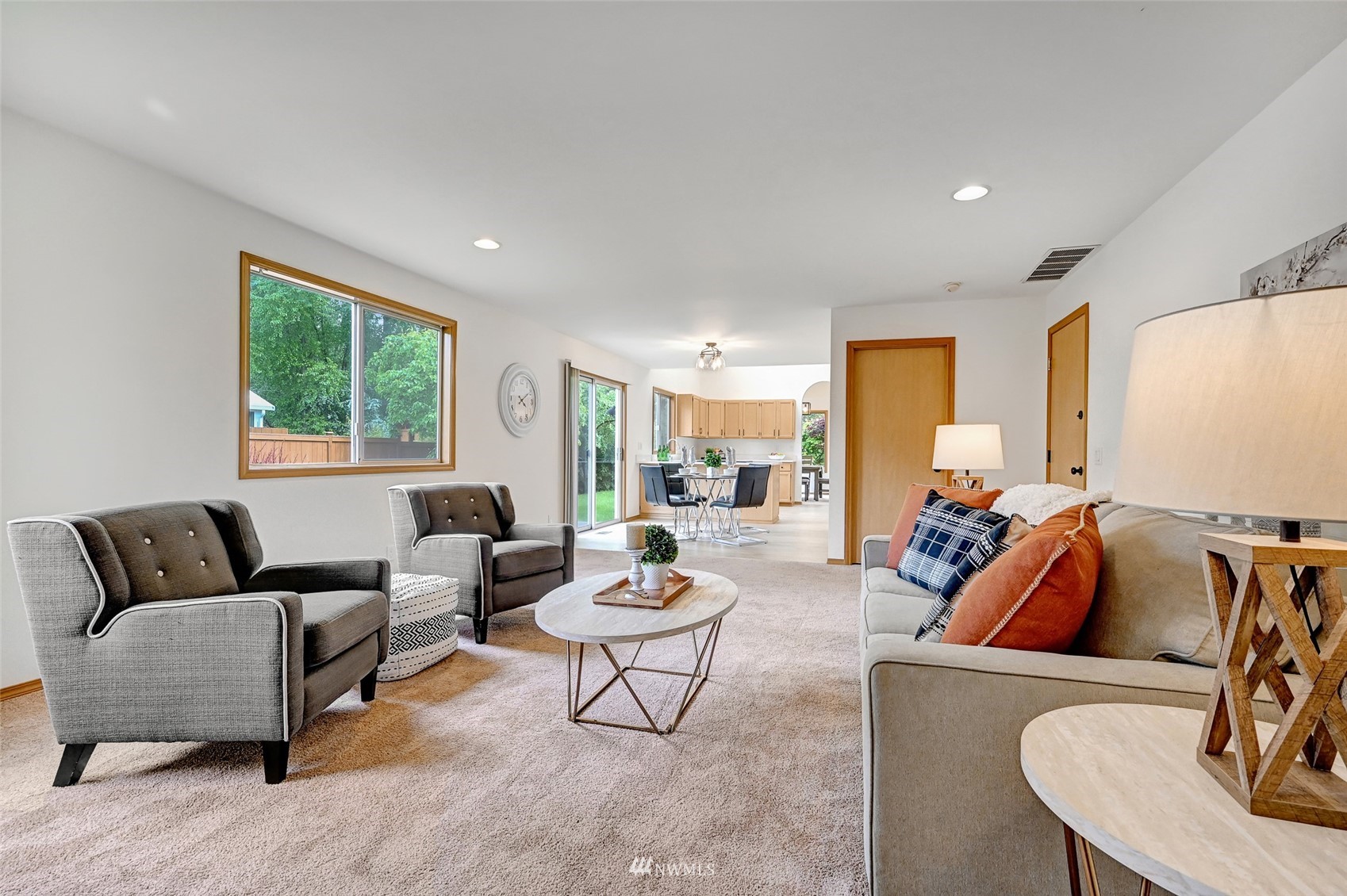 1422 243rd Place Southwest Bothell, WA 98021 - Photo 18 of 40 a living room with furniture and a large window