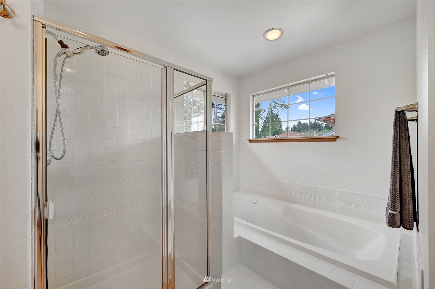 1422 243rd Place Southwest Bothell, WA 98021 - Photo 25 of 40 a bathroom with a bathtub and a shower