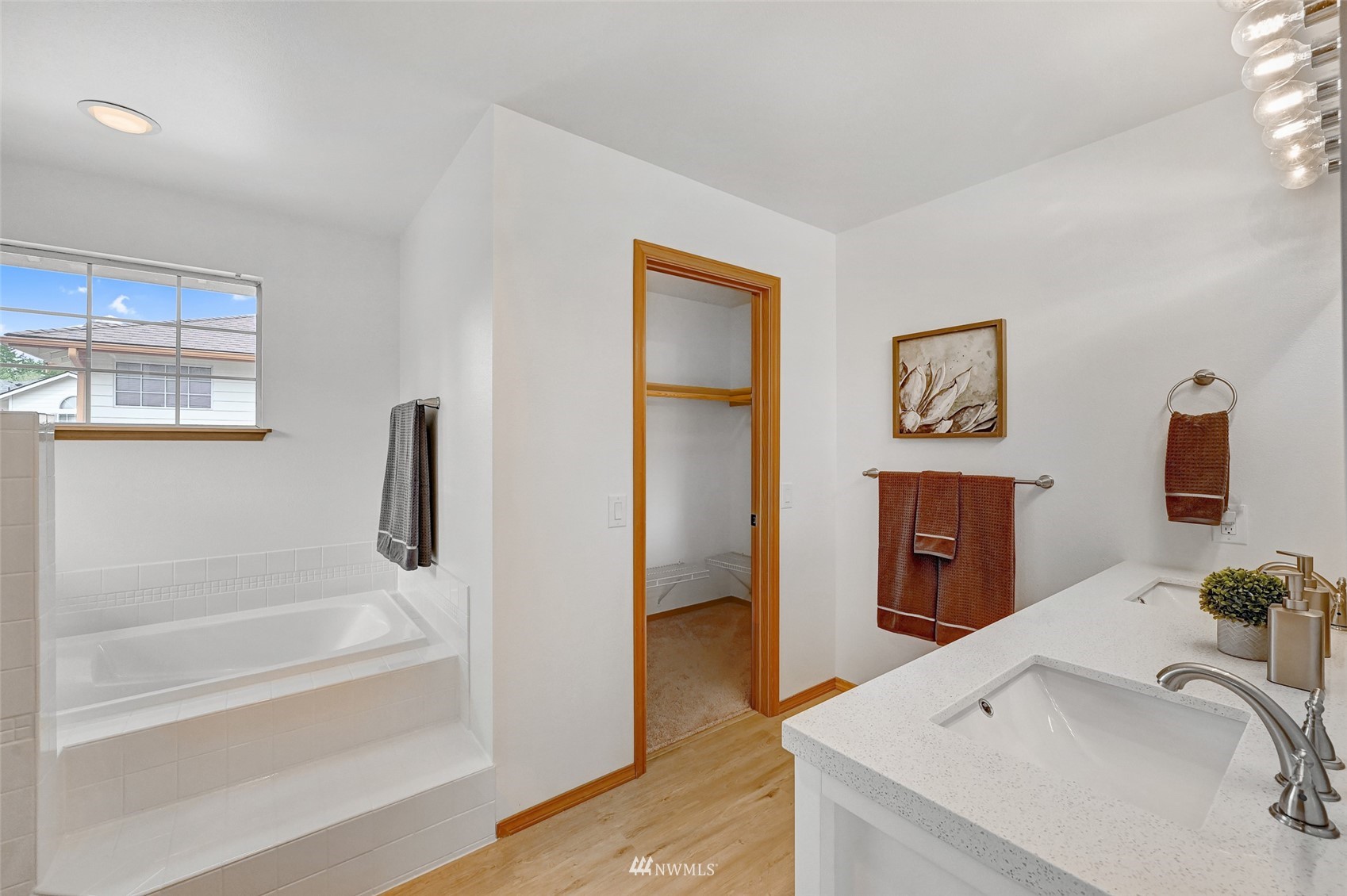 1422 243rd Place Southwest Bothell, WA 98021 - Photo 26 of 40 a bathroom with a tub and a sink