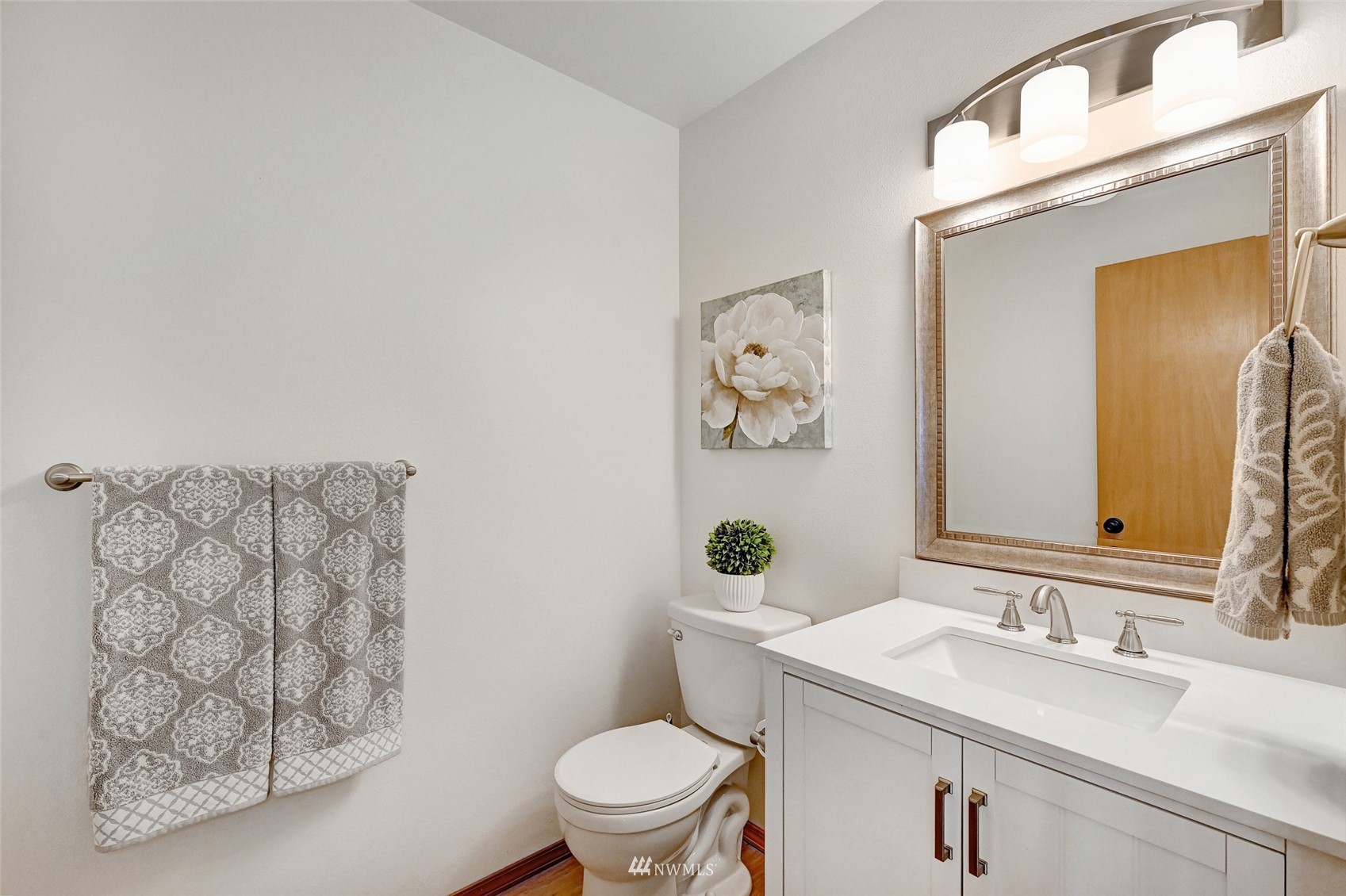 1422 243rd Place Southwest Bothell, WA 98021 - Photo 34 of 40 a bathroom with a granite countertop toilet sink and mirror