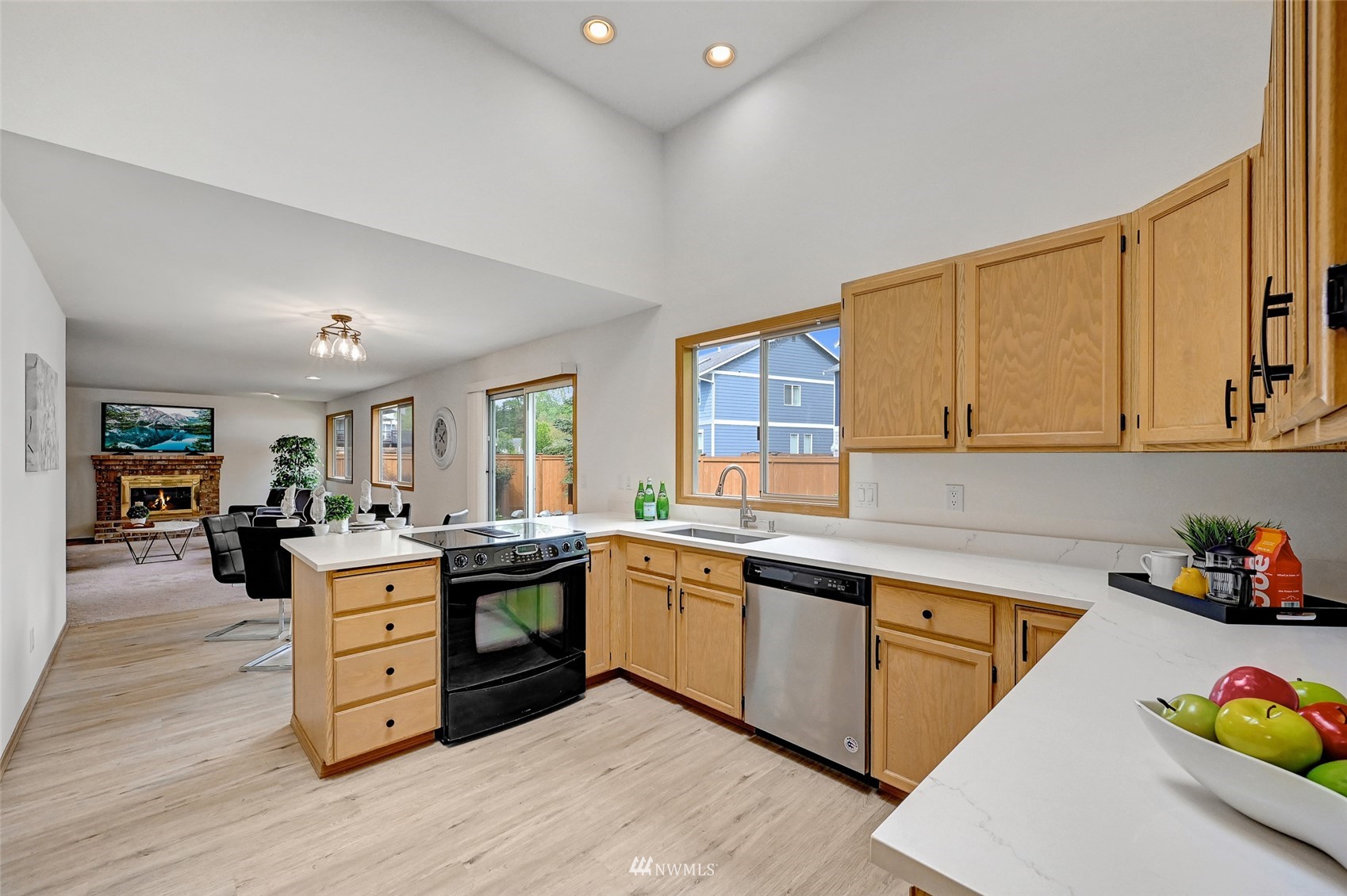 1422 243rd Place Southwest Bothell, WA 98021 - Photo 7 of 40 a kitchen with stainless steel appliances granite countertop a sink and cabinets