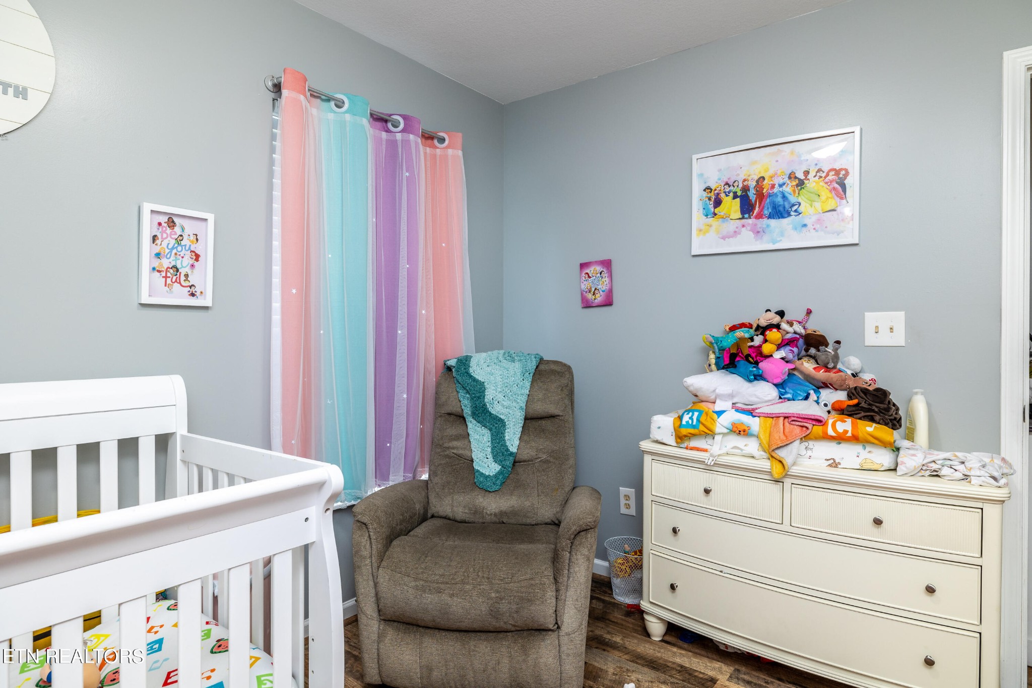 228 West Edison Street Alcoa, TN 37701 - Photo 16 of 24 a living room with furniture and baby crib