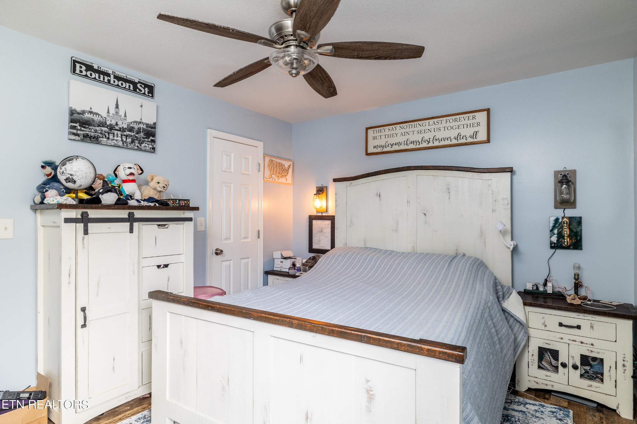 228 West Edison Street Alcoa, TN 37701 - Photo 20 of 24 a bedroom with a bed and a chandelier