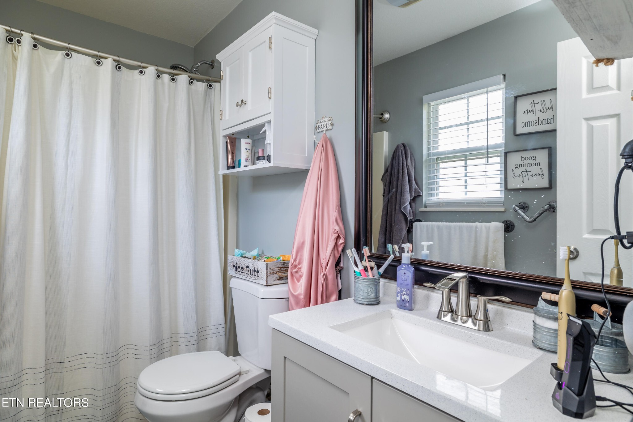 228 West Edison Street Alcoa, TN 37701 - Photo 21 of 24 a bathroom with a sink a toilet and a mirror