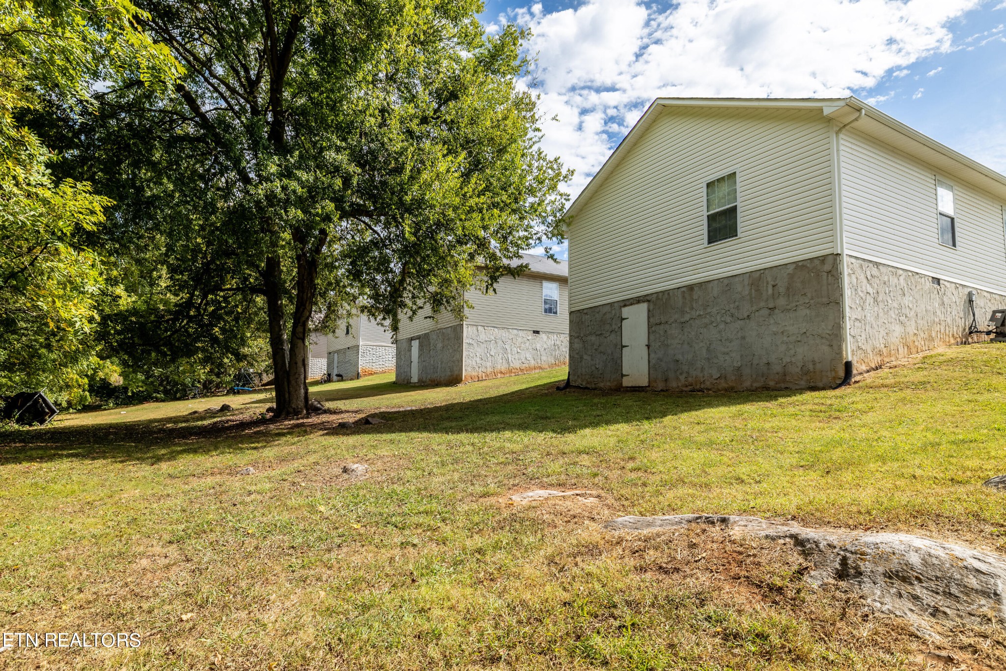 228 West Edison Street Alcoa, TN 37701 - Photo 23 of 24 a backyard of a house with a yard and garage
