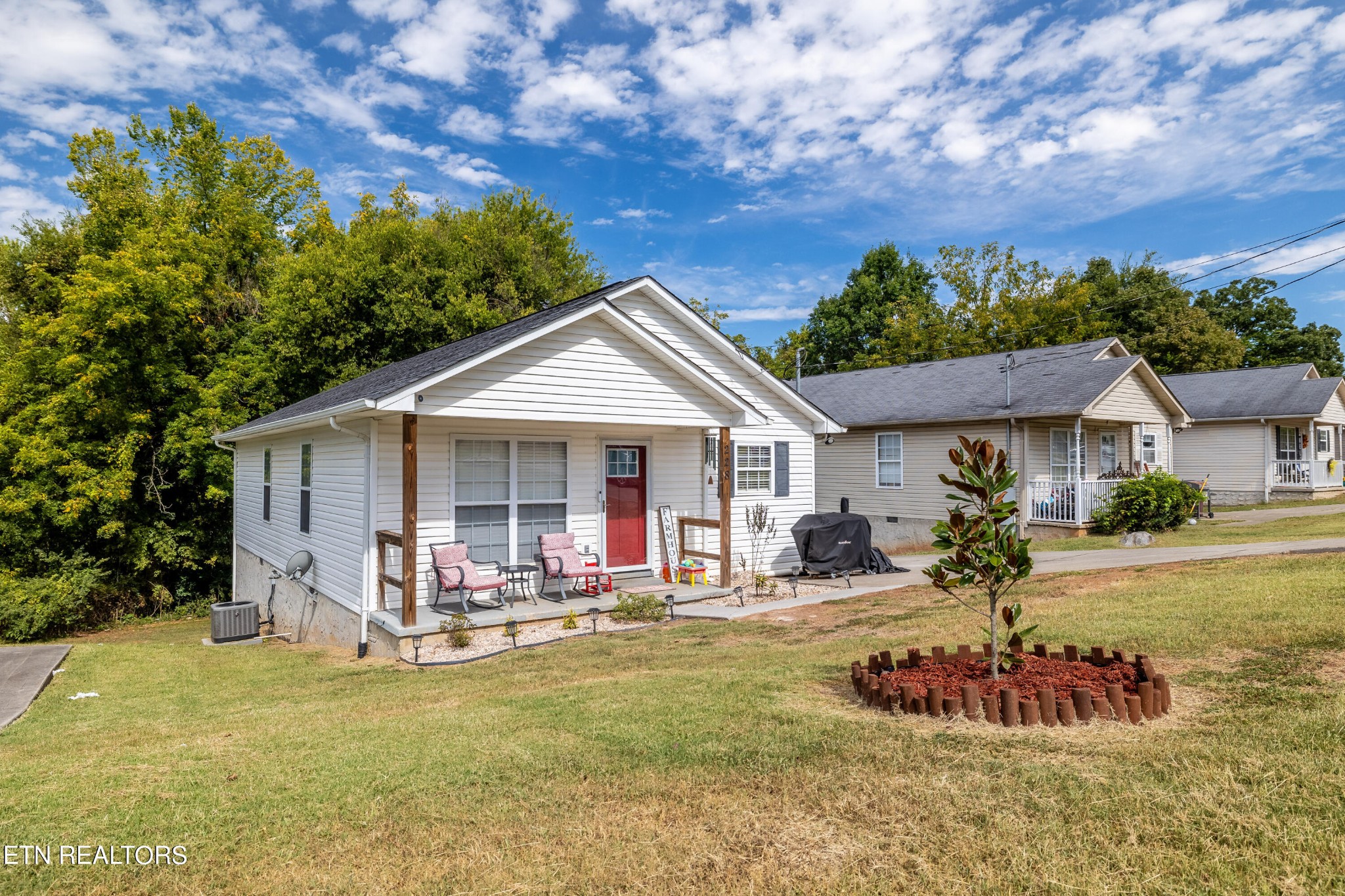 228 West Edison Street Alcoa, TN 37701 - Photo 4 of 24 a front view of a house with a yard table and chairs