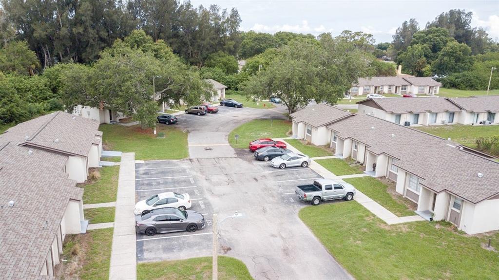 an aerial view of a house with a yard pool stove and outdoor seating