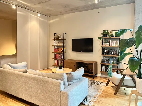 a living room with furniture and a flat screen tv